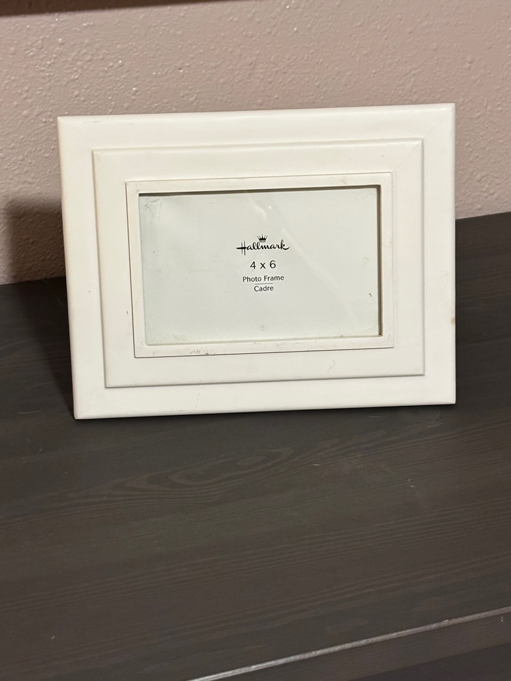 White HallmarkOne 4”x6” picture frame. And FREE four extra frames.